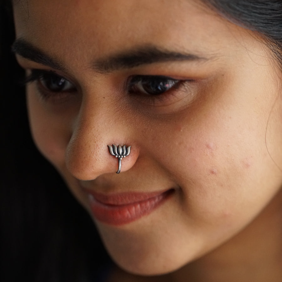 a close up of a person with a nose piercing