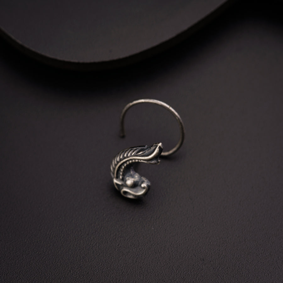 a close up of a ring on a black surface