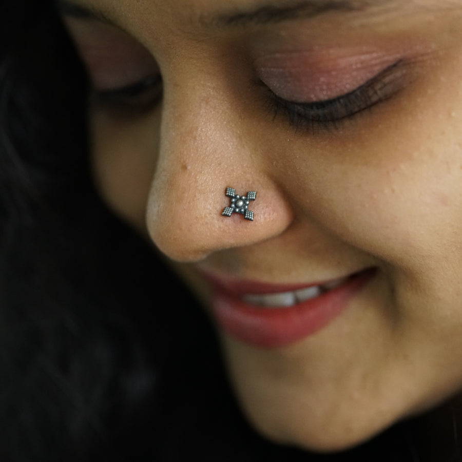 a close up of a person with a nose piercing