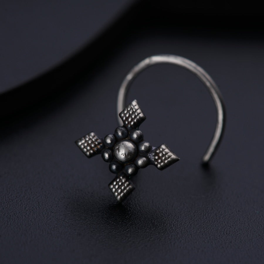 a close up of a ring on a black surface