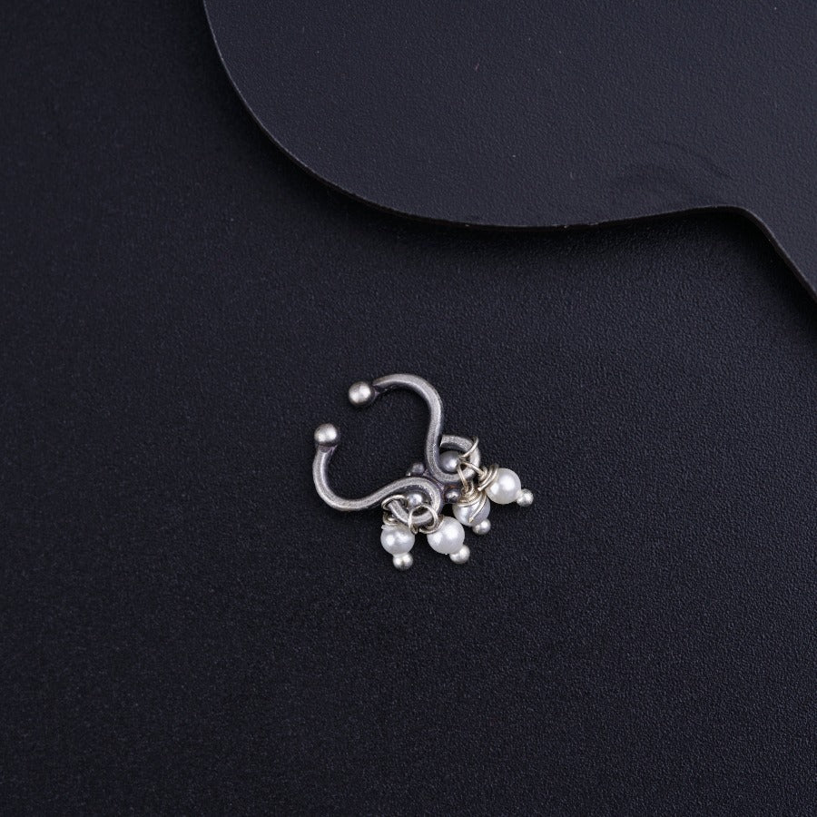 a close up of a pair of nose rings