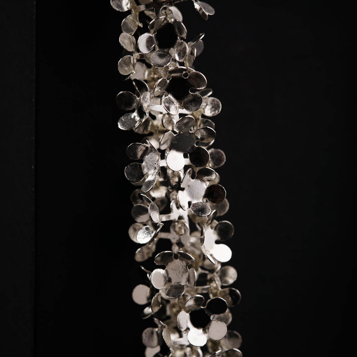 a bunch of glass beads hanging from the ceiling