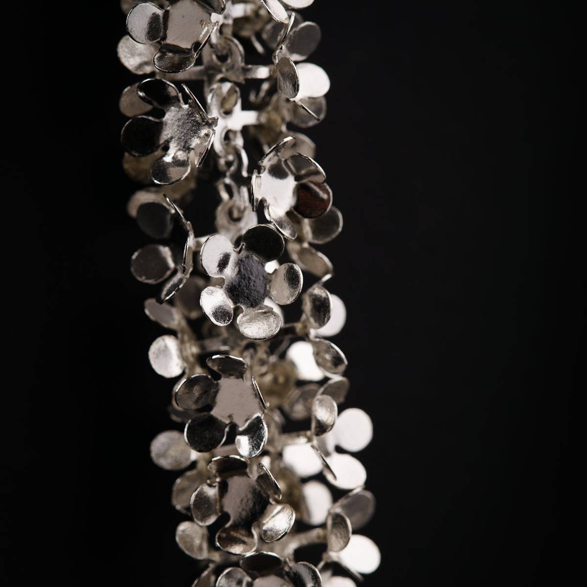 a close up of a chain of metal objects