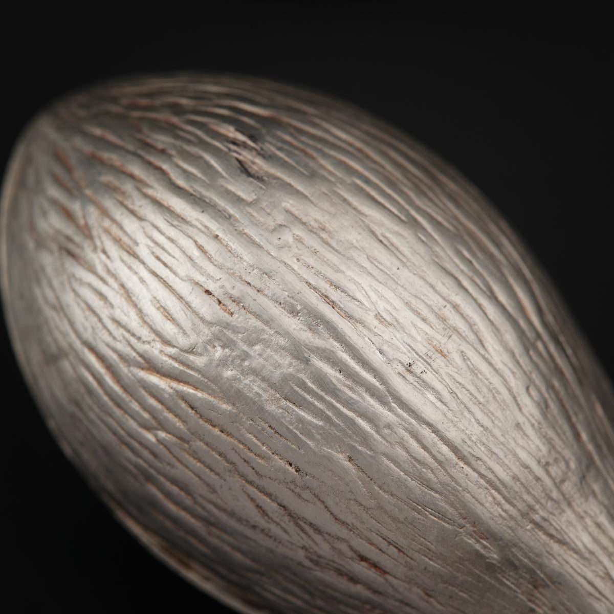 a close up of a nut shell on a black background