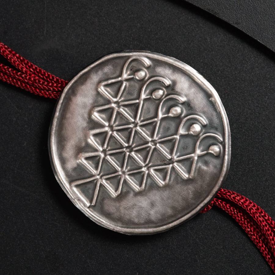 a silver coin sitting on top of a table