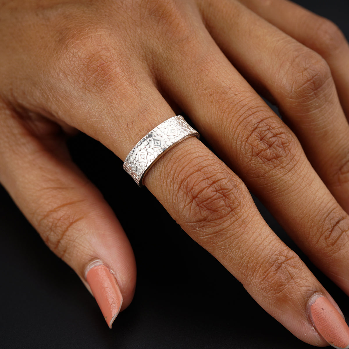 a woman's hand with a ring on it