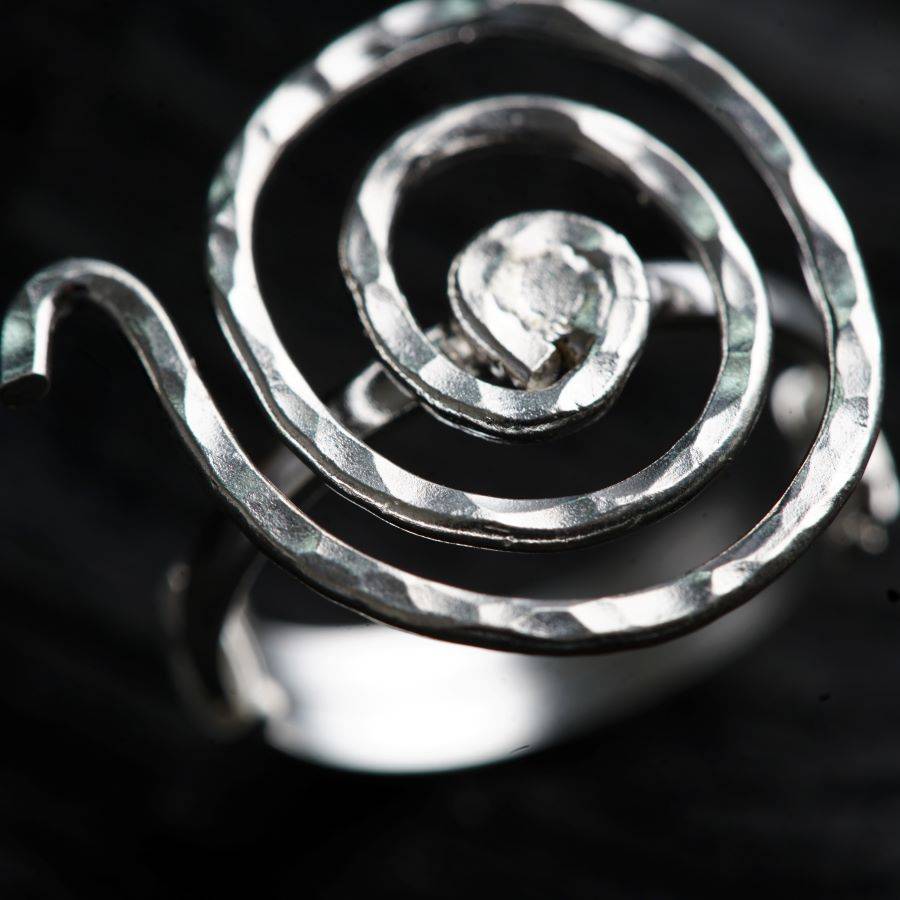 a close up of a ring with a diamond in it