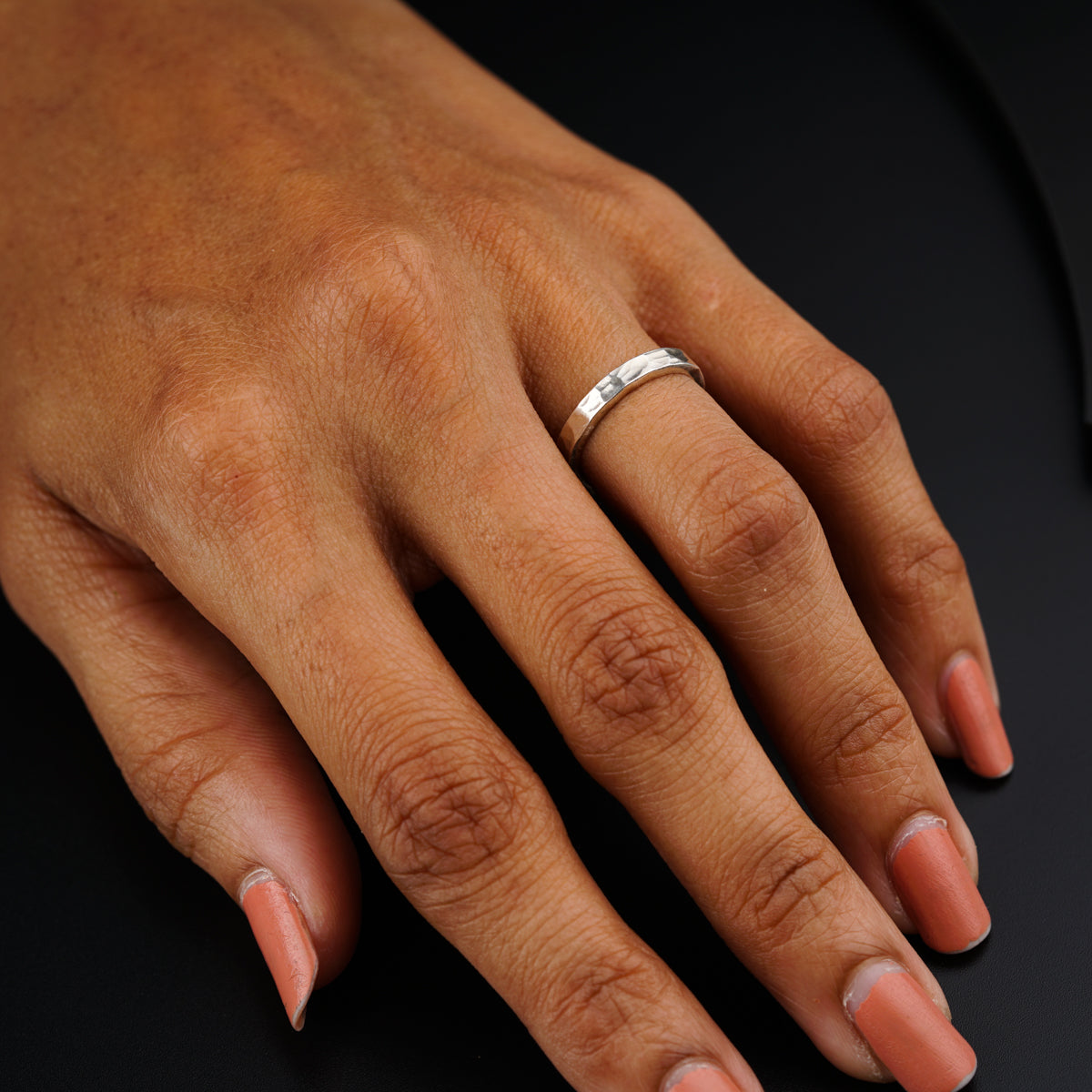 a woman's hand with a ring on it