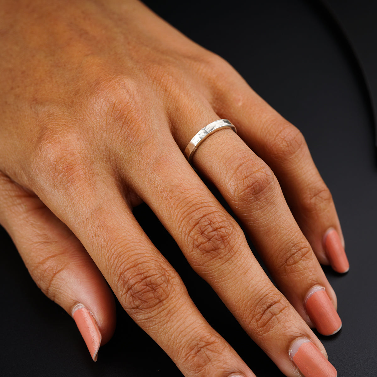 a woman's hand with a ring on it