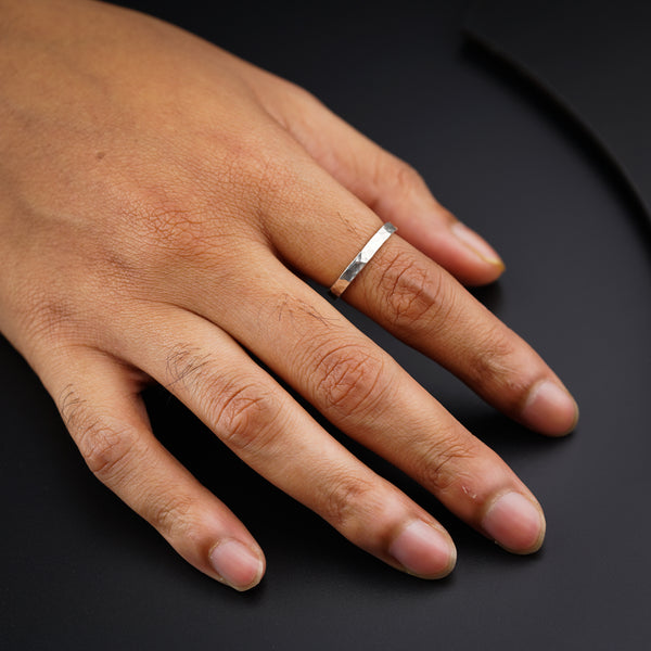 Unisex hammered silver ring on hand