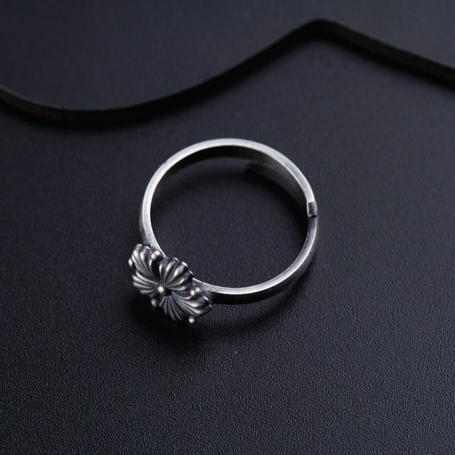 a close up of a ring on a black surface