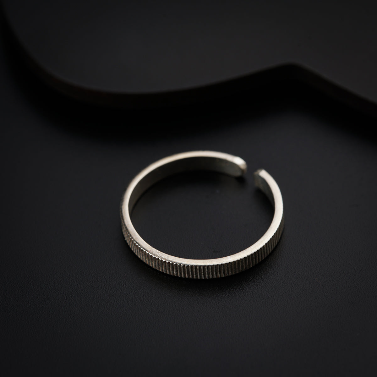 a close up of a ring on a black surface