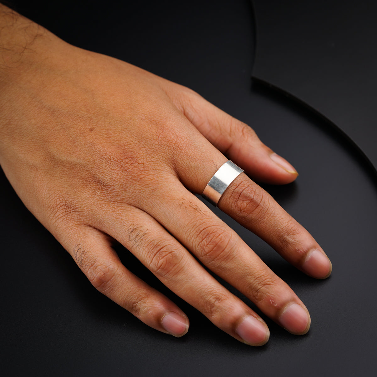 Minimal plain silver band ring detailing