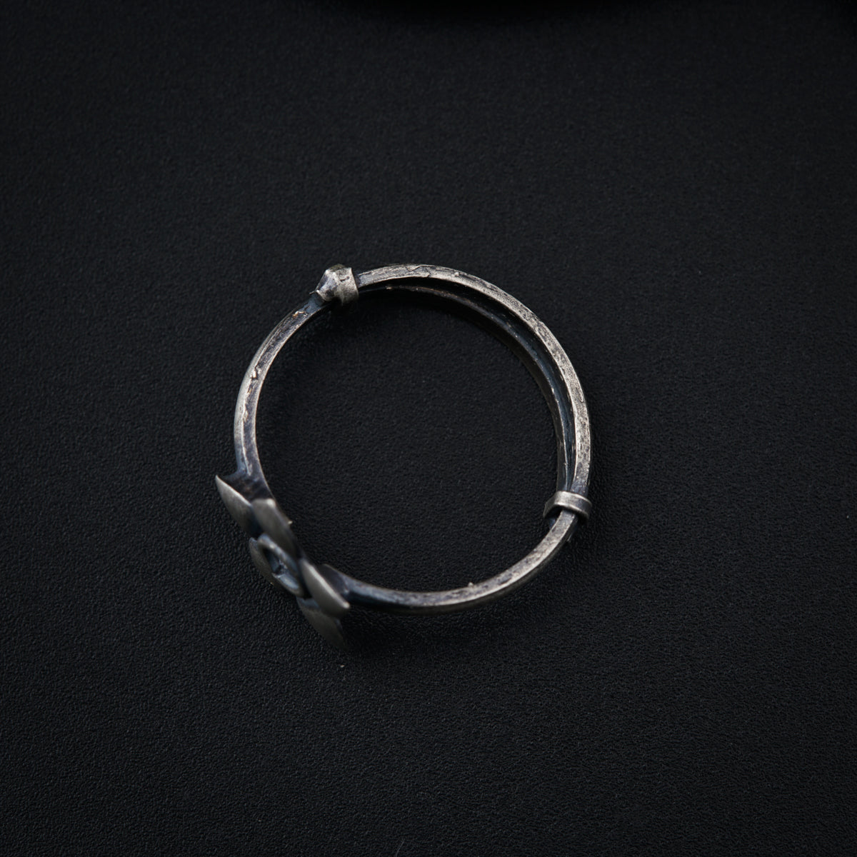 a close up of a ring on a black surface