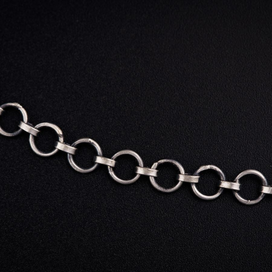 a silver chain on a black background