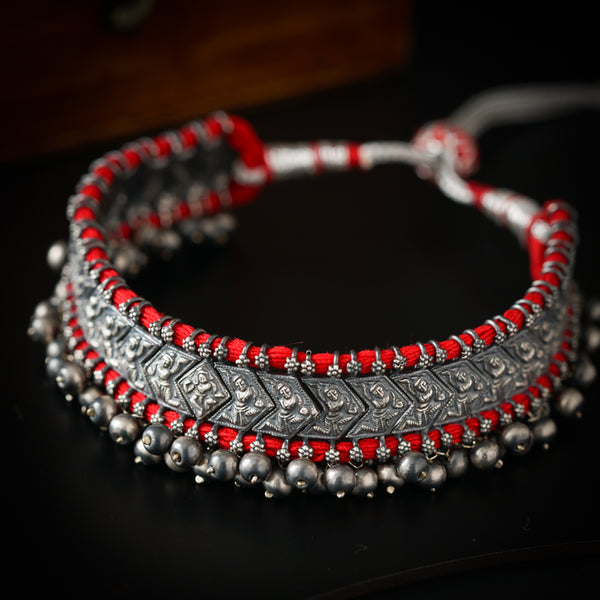 a close up of a bracelet on a table