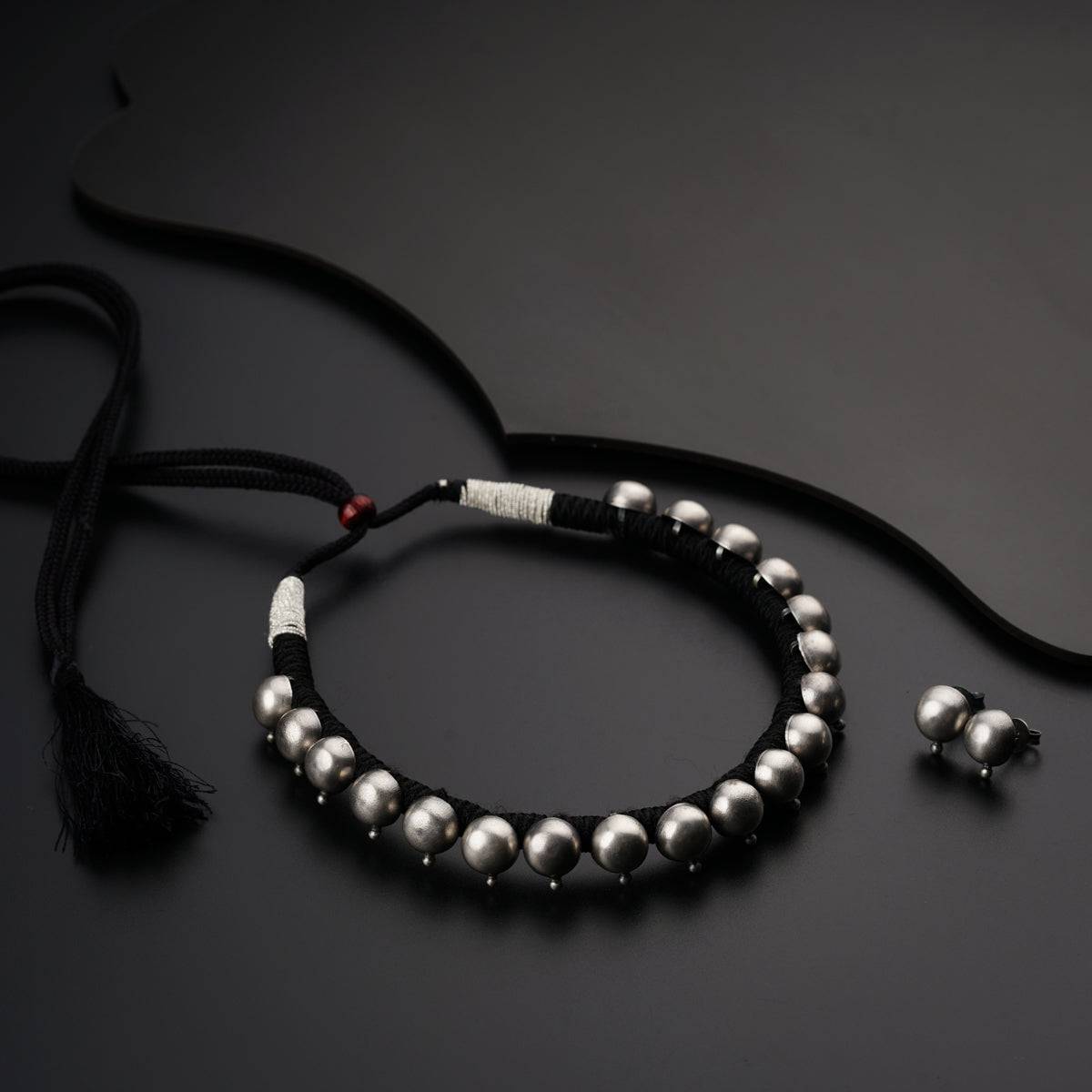 a couple of bracelets sitting on top of a table