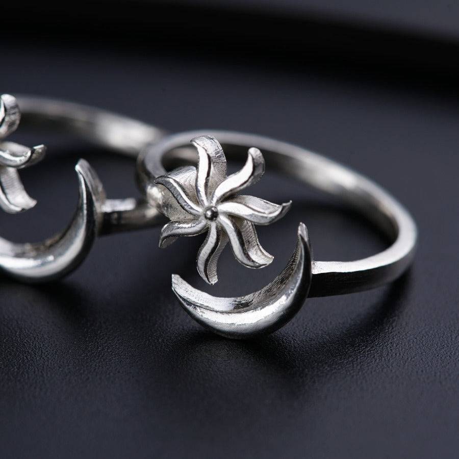 a close up of two rings on a table