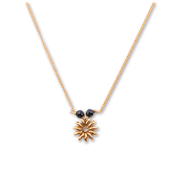 Gold chain with black beads and sun pendant