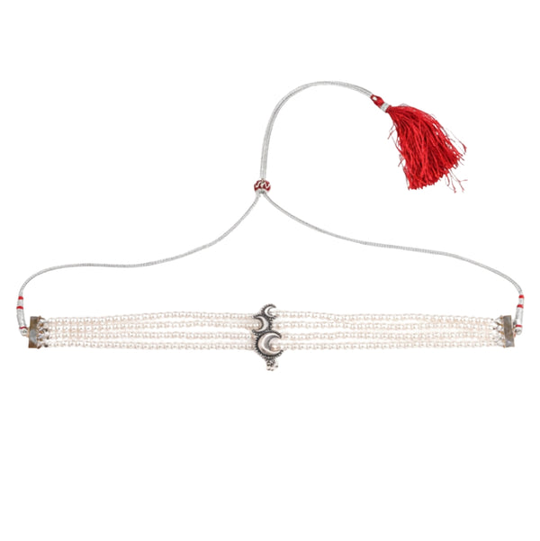 Macro detail of crescent motif and pearl setting on 92.5 sterling silver Chandrakor choker