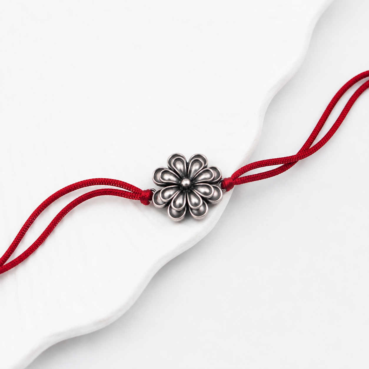 Handcrafted Silver Rakhi/Pendant: Double Flower