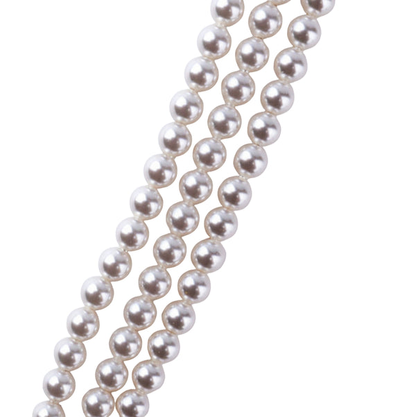 Close-up of pearl strands with sterling silver pendant and gemstone accents