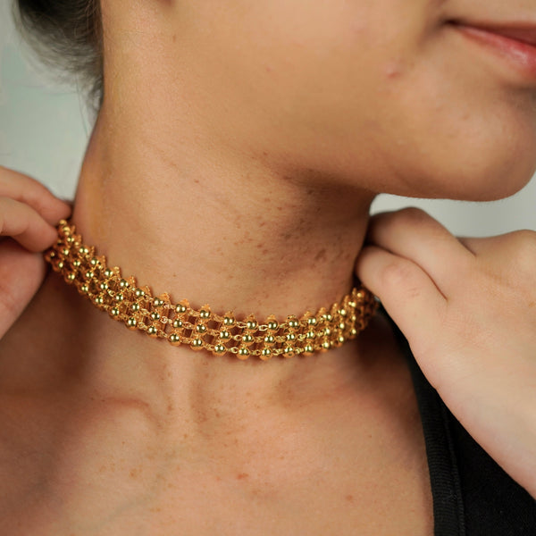 Model wearing gold silver two way choker