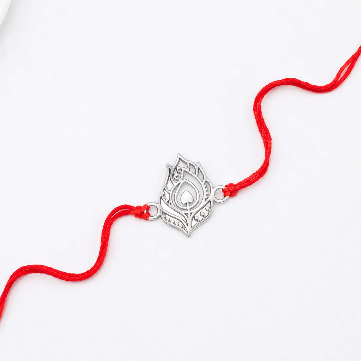 Silver Laser Cut Peacock Feather Rakhi