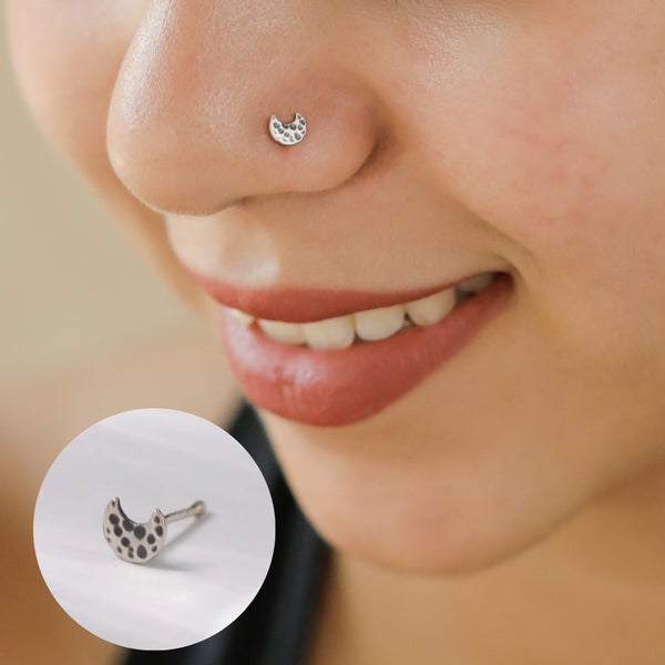Close-up of Silver Tiny Hammered Chandrakor Nose Pin texture