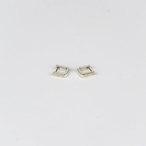 Close-up of Silver CZ U Shape Earrings with Sparkling Stones