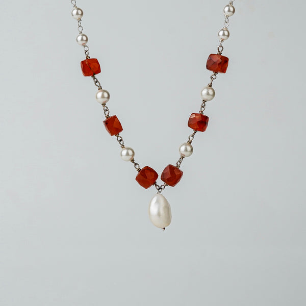 Detail shot of pearl ganthan pattern and stone accents