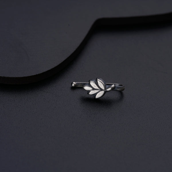a close up of a ring on a black surface