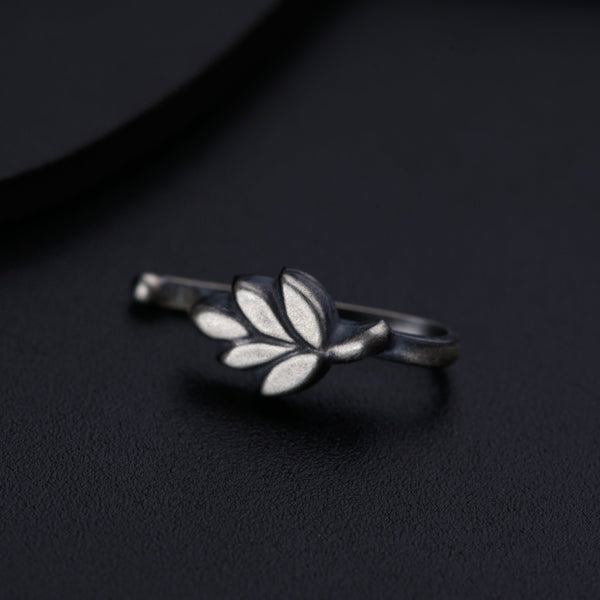 a close up of a ring on a black surface