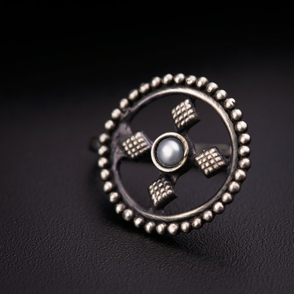 a close up of a ring on a black surface