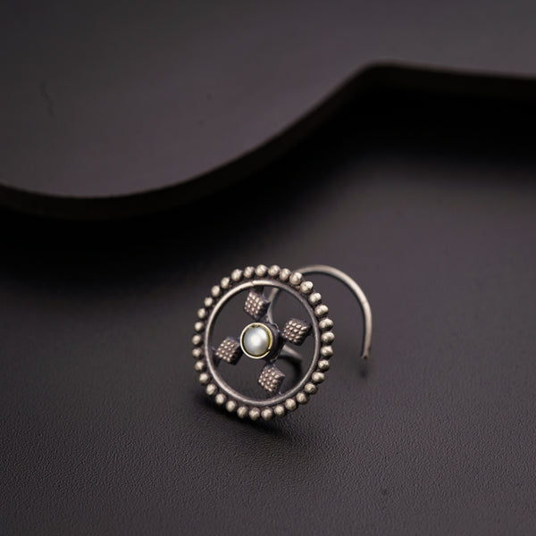 a pair of earrings sitting on top of a table