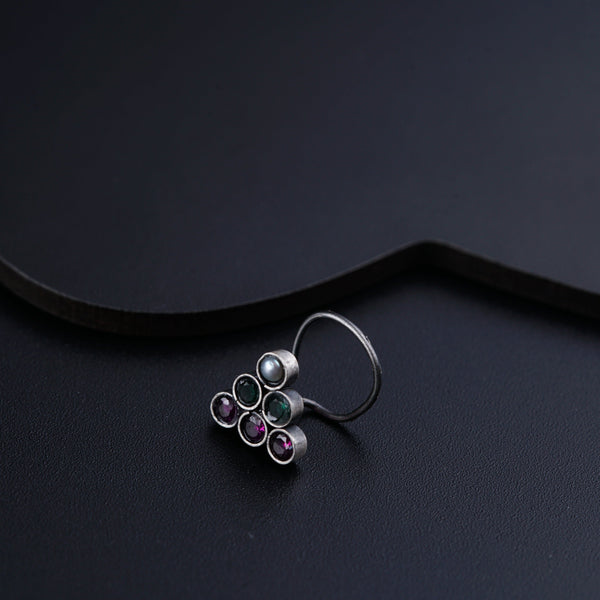 a close up of a ring on a black surface
