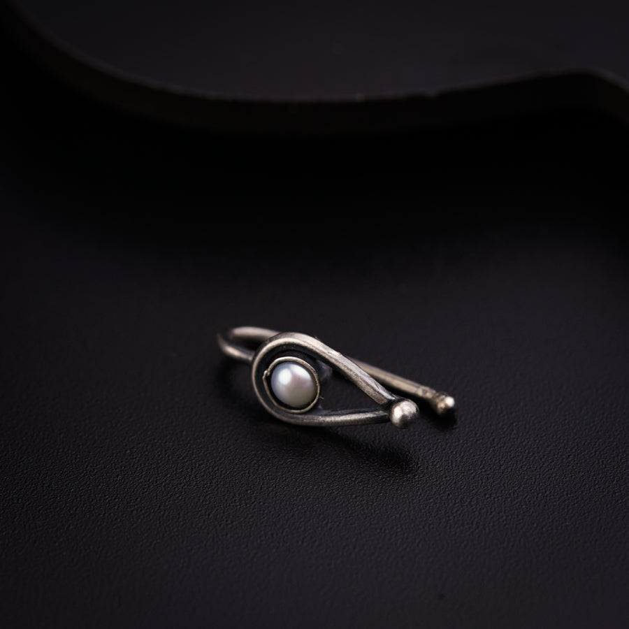 a close up of a ring on a black surface