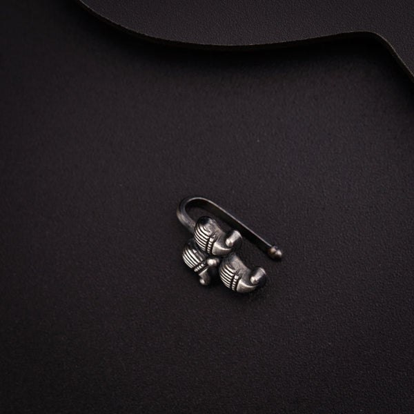 a black table with a pair of metal hooks