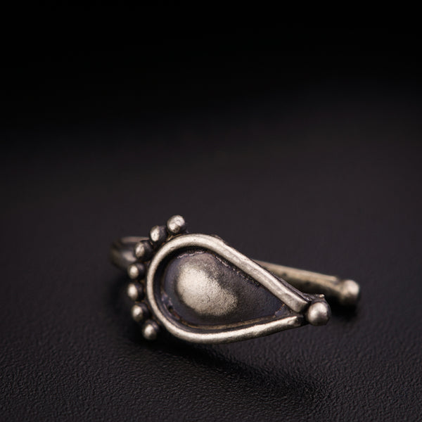 a close up of a ring on a black surface