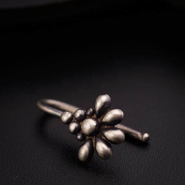 a close up of a ring on a black surface