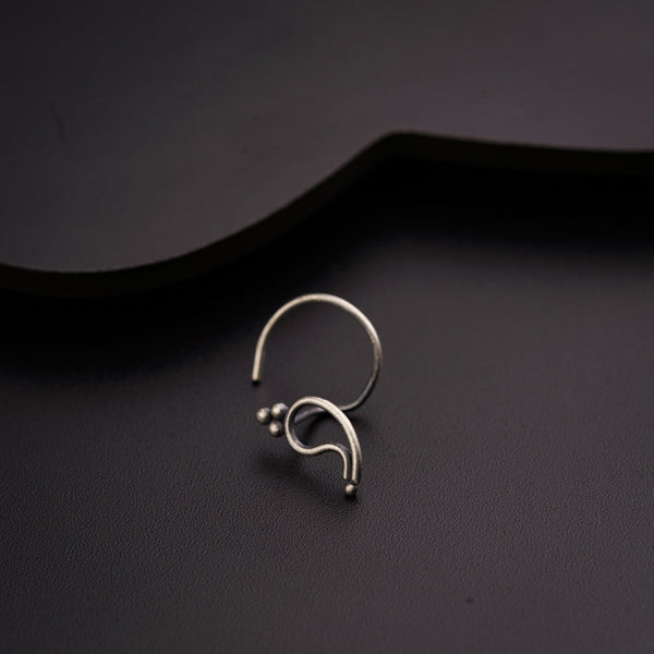 a close up of a ring on a black surface