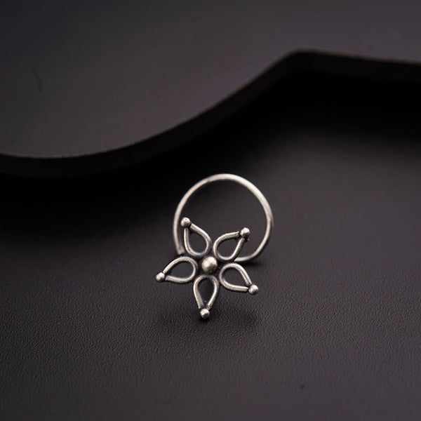a close up of a ring on a black surface
