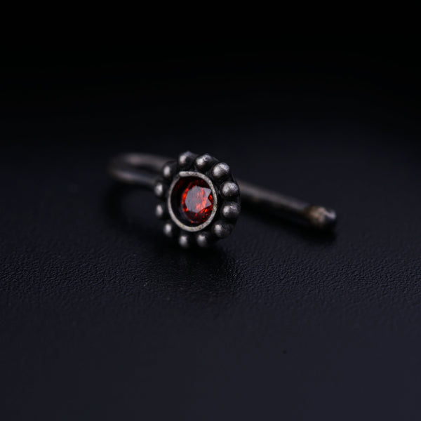 a close up of a ring on a black surface