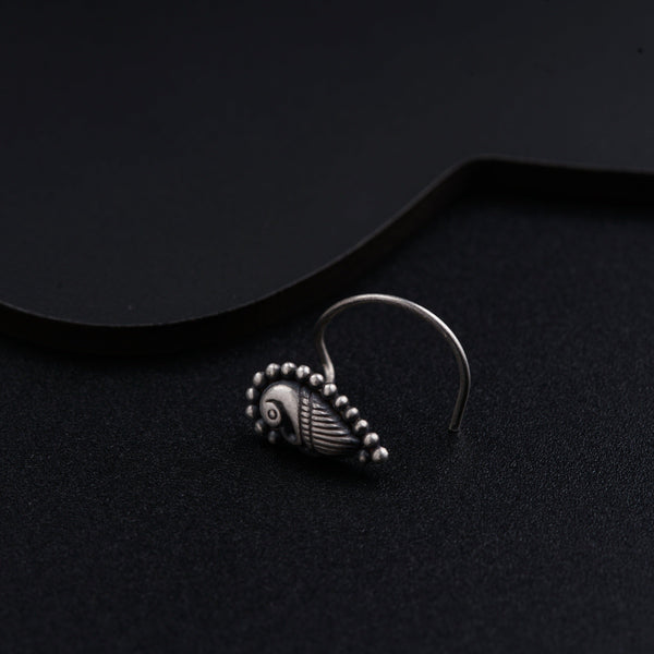 a close up of a ring on a black surface