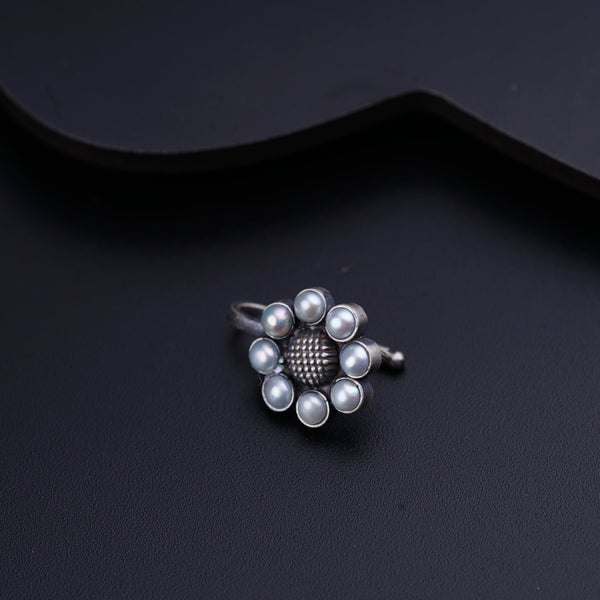 a close up of a ring on a black surface