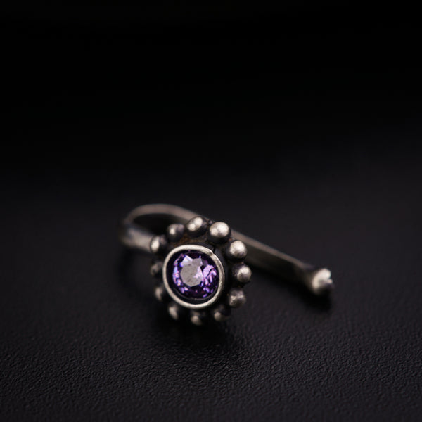 a close up of a ring on a black surface