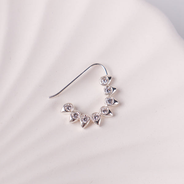 Close-up of CZ petal nath big pierced silver earring