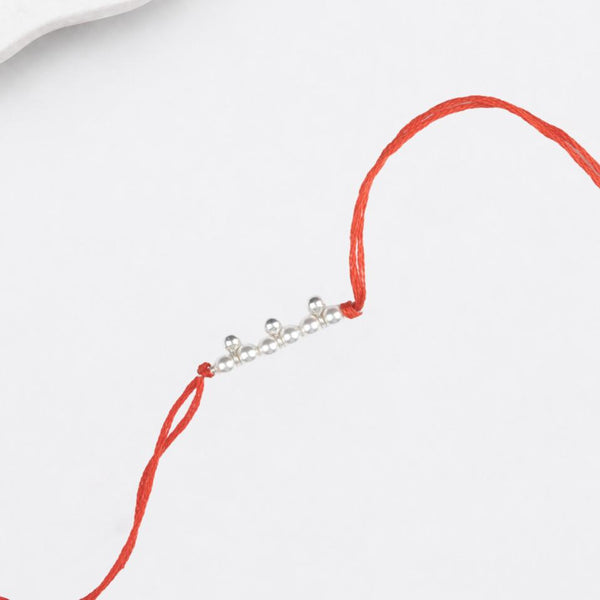 Close-up of Pearl & Silver Bead Rakhi craftsmanship
