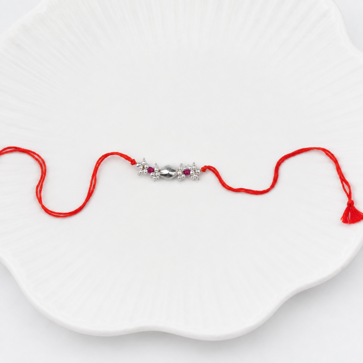 Silver Dholki Bead, Ruby & Pearl Bunch Rakhi (Project Handmade)