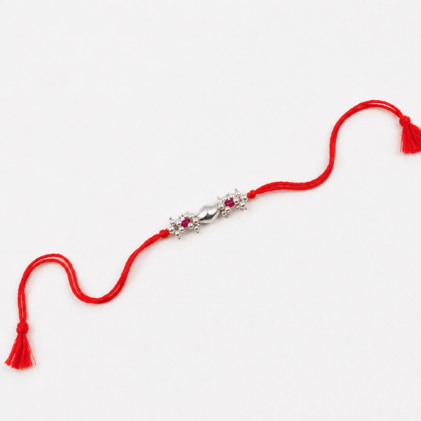 Ruby and pearl gemstone Rakhi with traditional silver Dholki beads